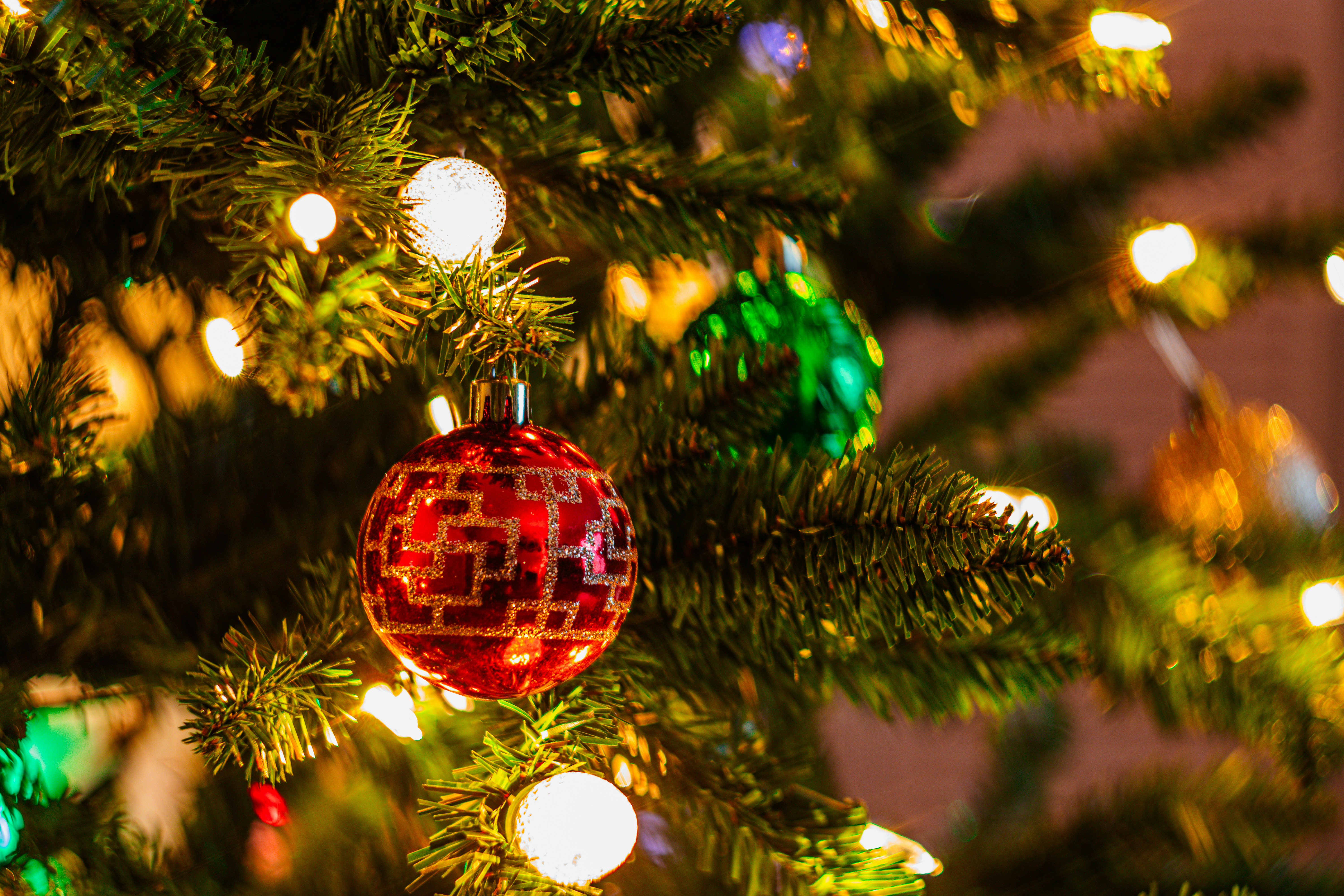 a close up of a christmas ornament on a tree