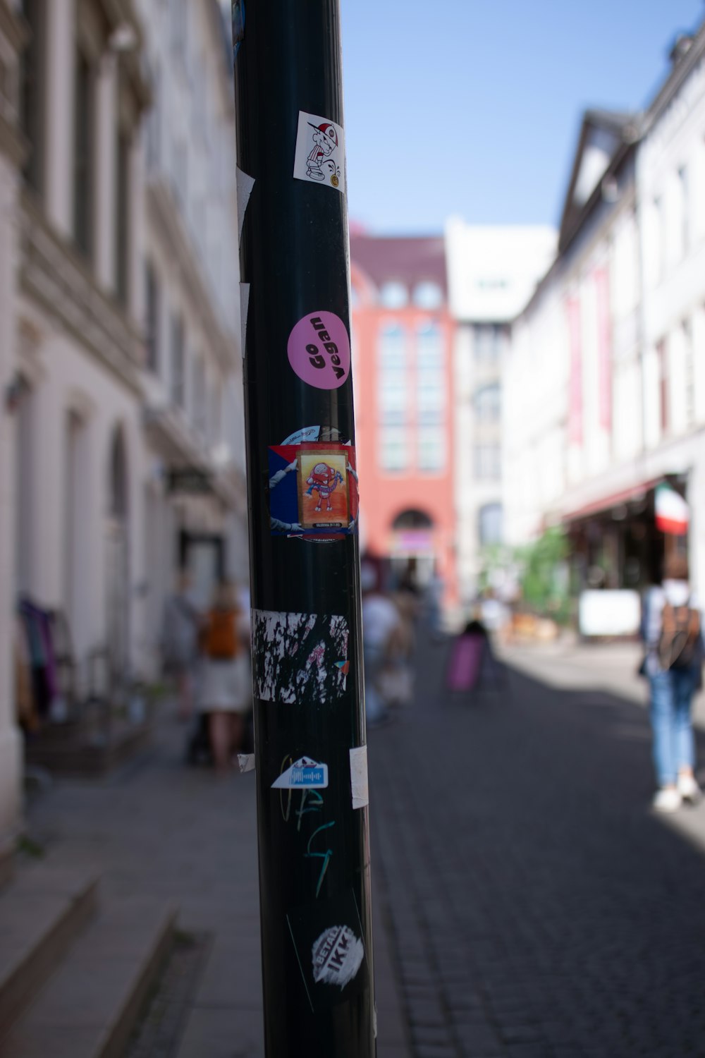 a pole with a bunch of stickers on it