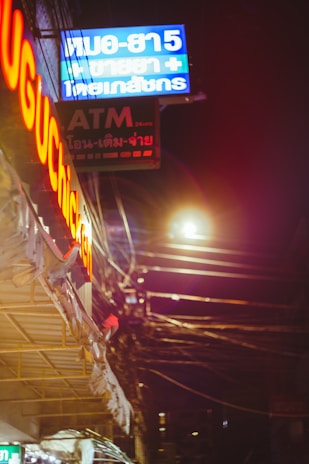 Payment method icons tailored for Thailand glowing softly in neon colors.