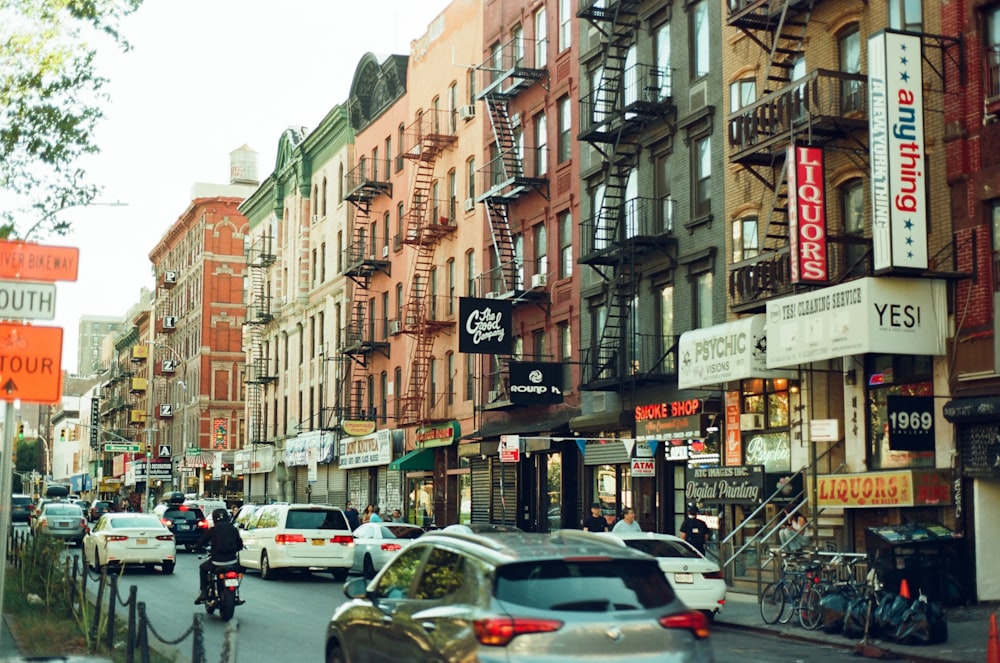 a city street filled with lots of tall buildings