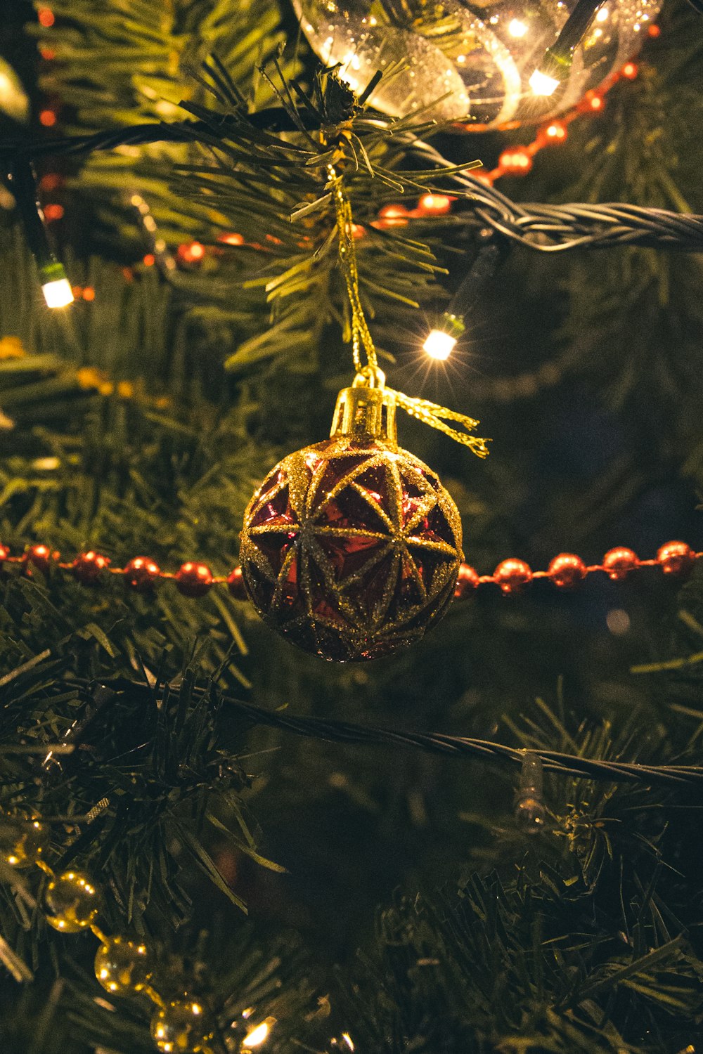 a christmas ornament hanging from a christmas tree