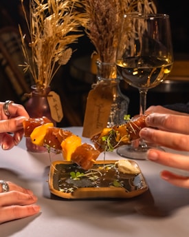 A vibrant food-themed dating event with couples enjoying dishes together.