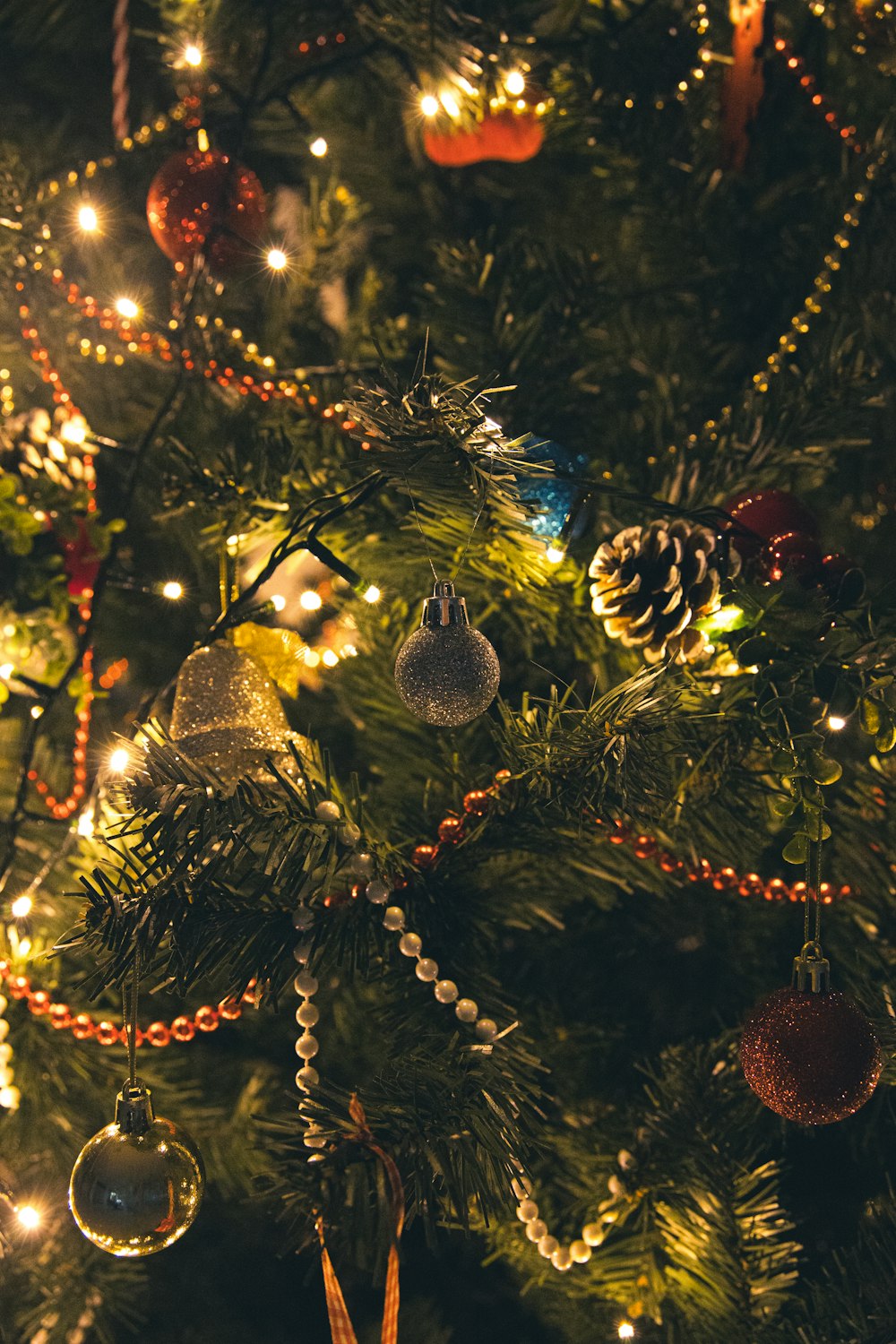 a close up of a christmas tree with ornaments