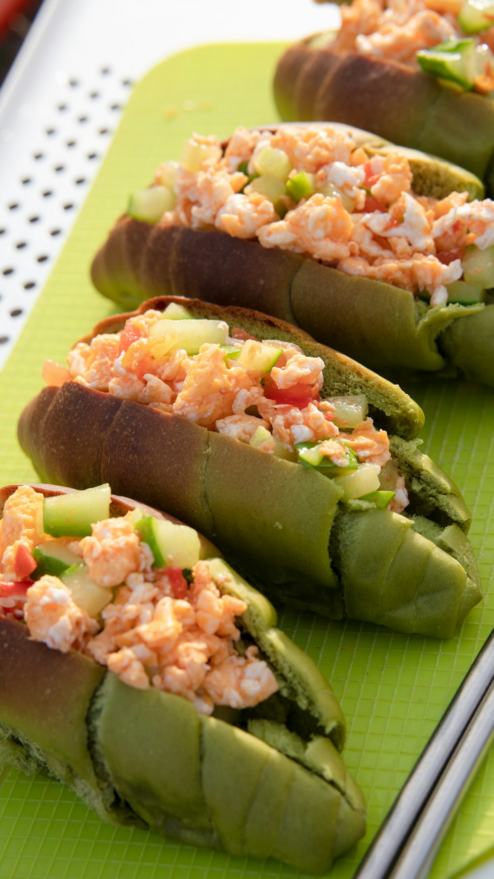 a close up of some food on a green tray