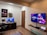 A cozy boys' room featuring a vibrant gaming rug.
