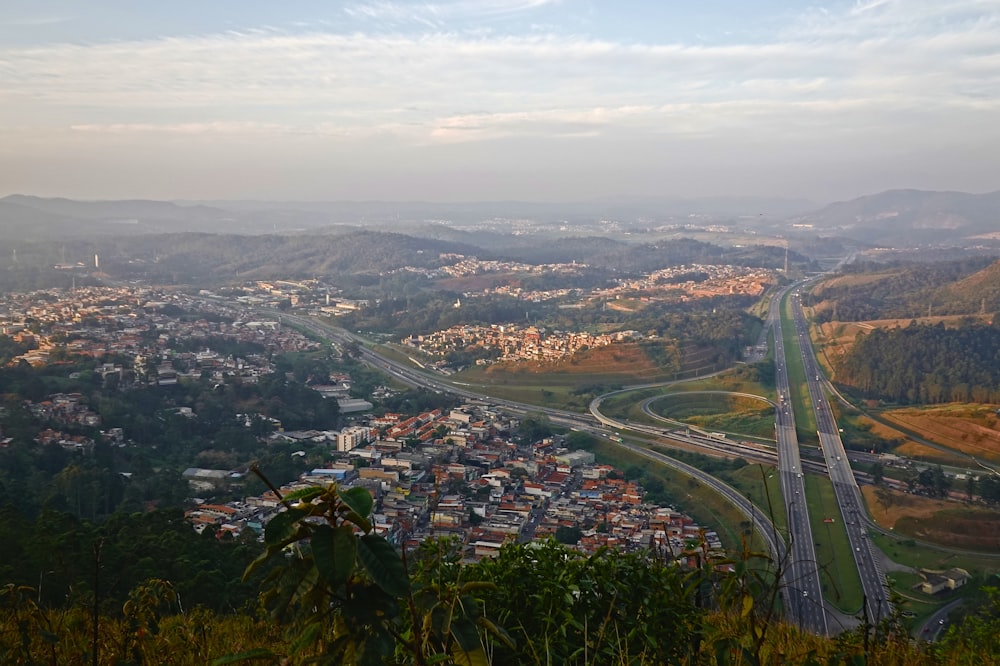 an aerial view of a city and a highway