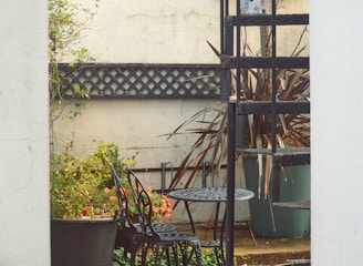 An elegant patio area featuring custom welding designs and outdoor furniture.