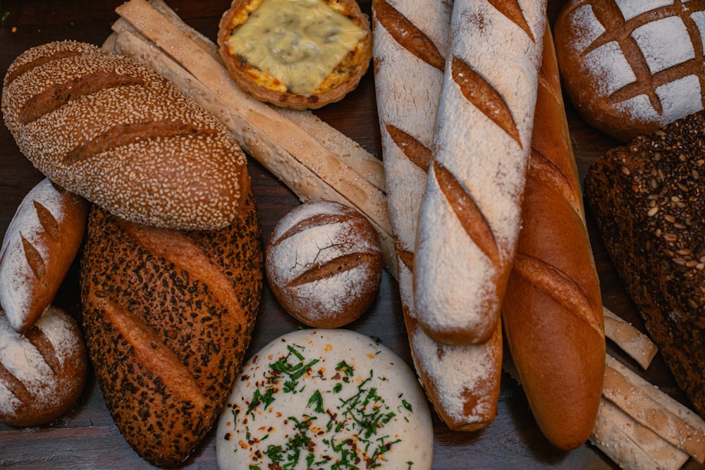 a variety of breads and pastries on a table