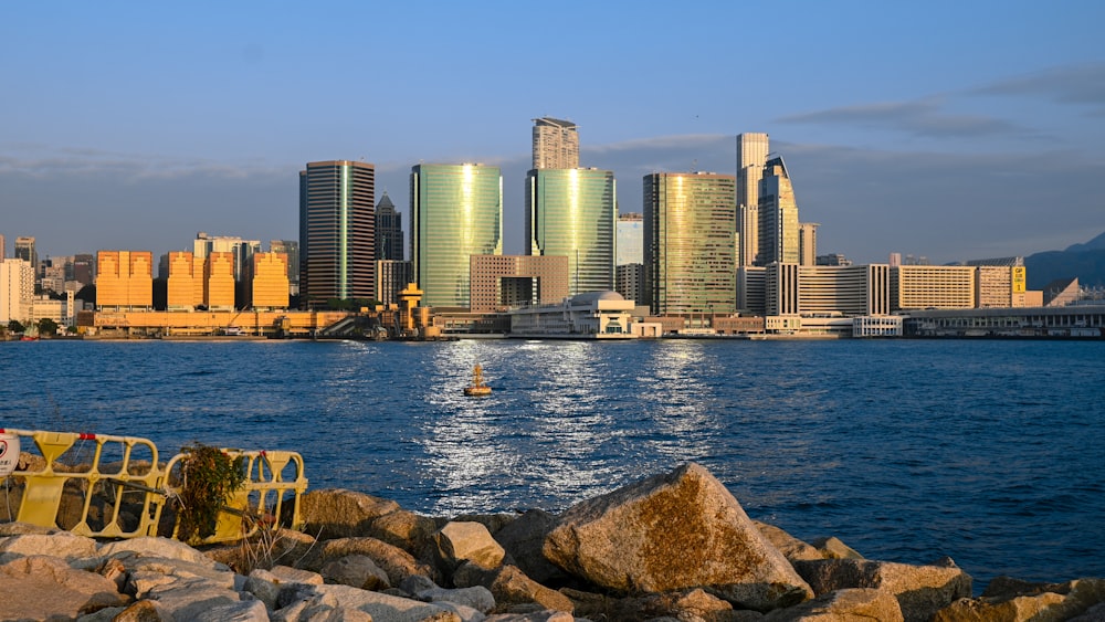 a body of water with a city in the background