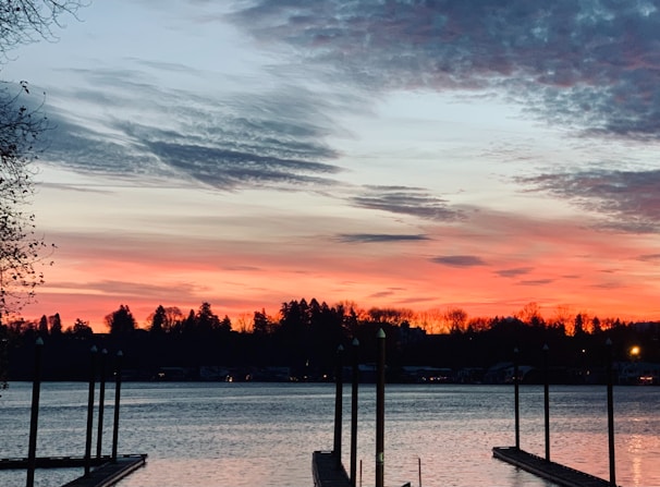 A picturesque sunset over a calm body of water.