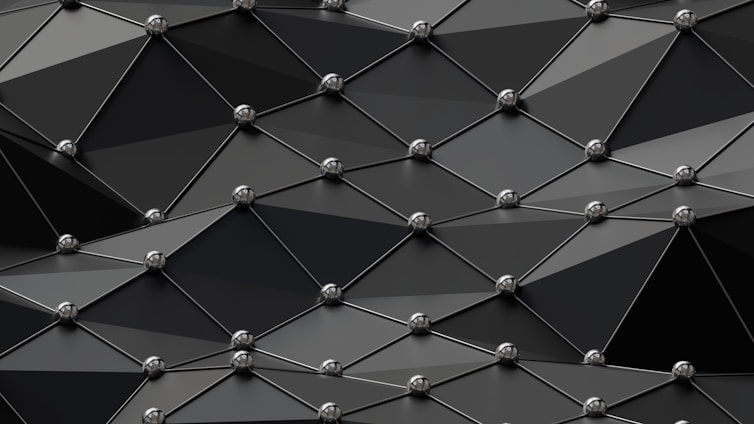 Abstract geometric shapes forming a sleek, modern pattern symbolizing innovation and clarity.