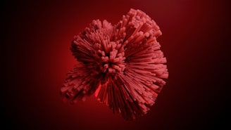 A 3D abstract structure composed of red rectangular blocks radiating outward in a spherical formation against a dark red background.