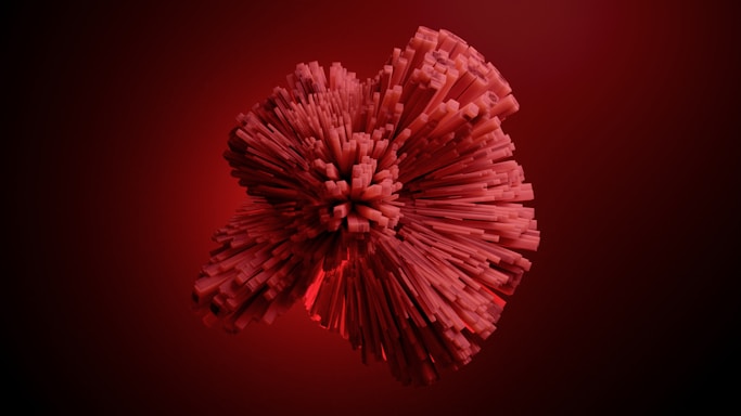 A 3D abstract structure composed of red rectangular blocks radiating outward in a spherical formation against a dark red background.