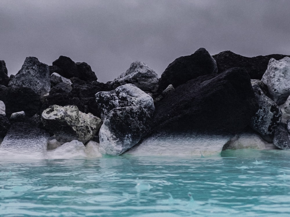 a body of water with rocks in it