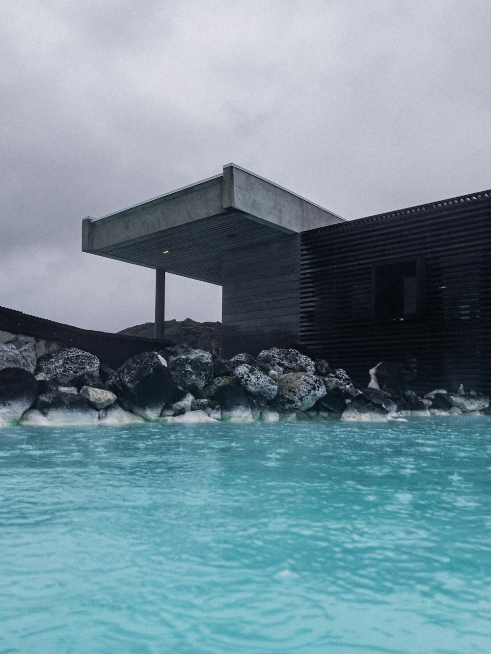 a large building sitting next to a body of water