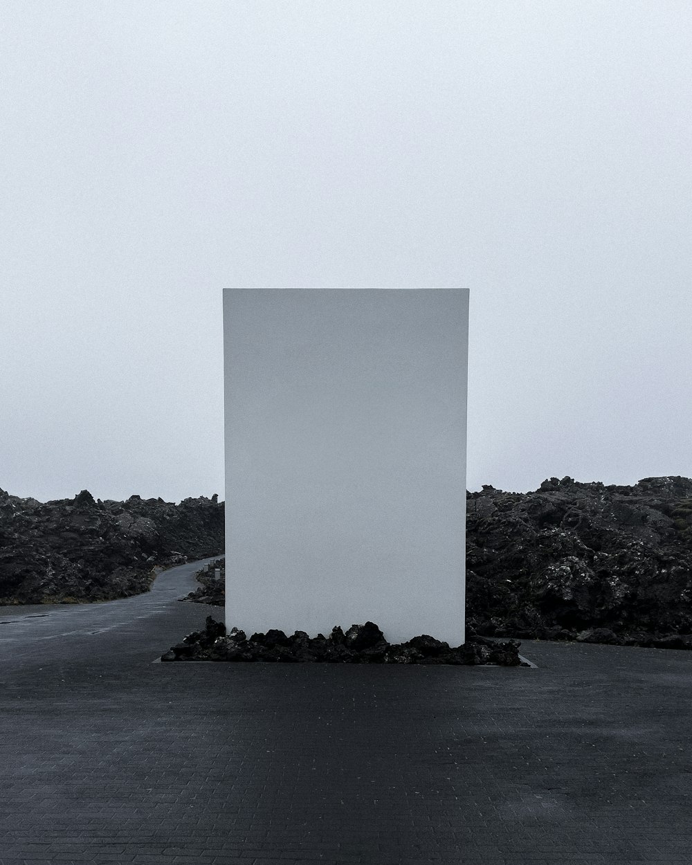 a large white box sitting in the middle of a road