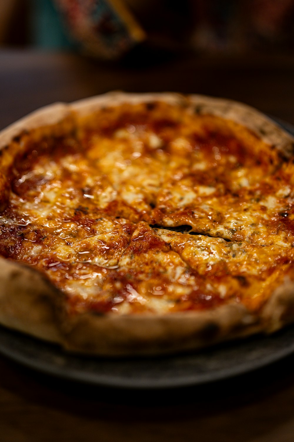 a close up of a pizza on a plate on a table