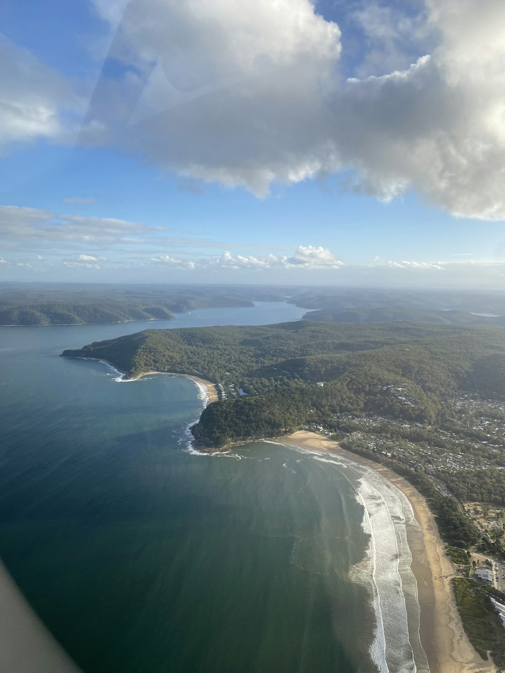 an aerial view of a beach and a body of water