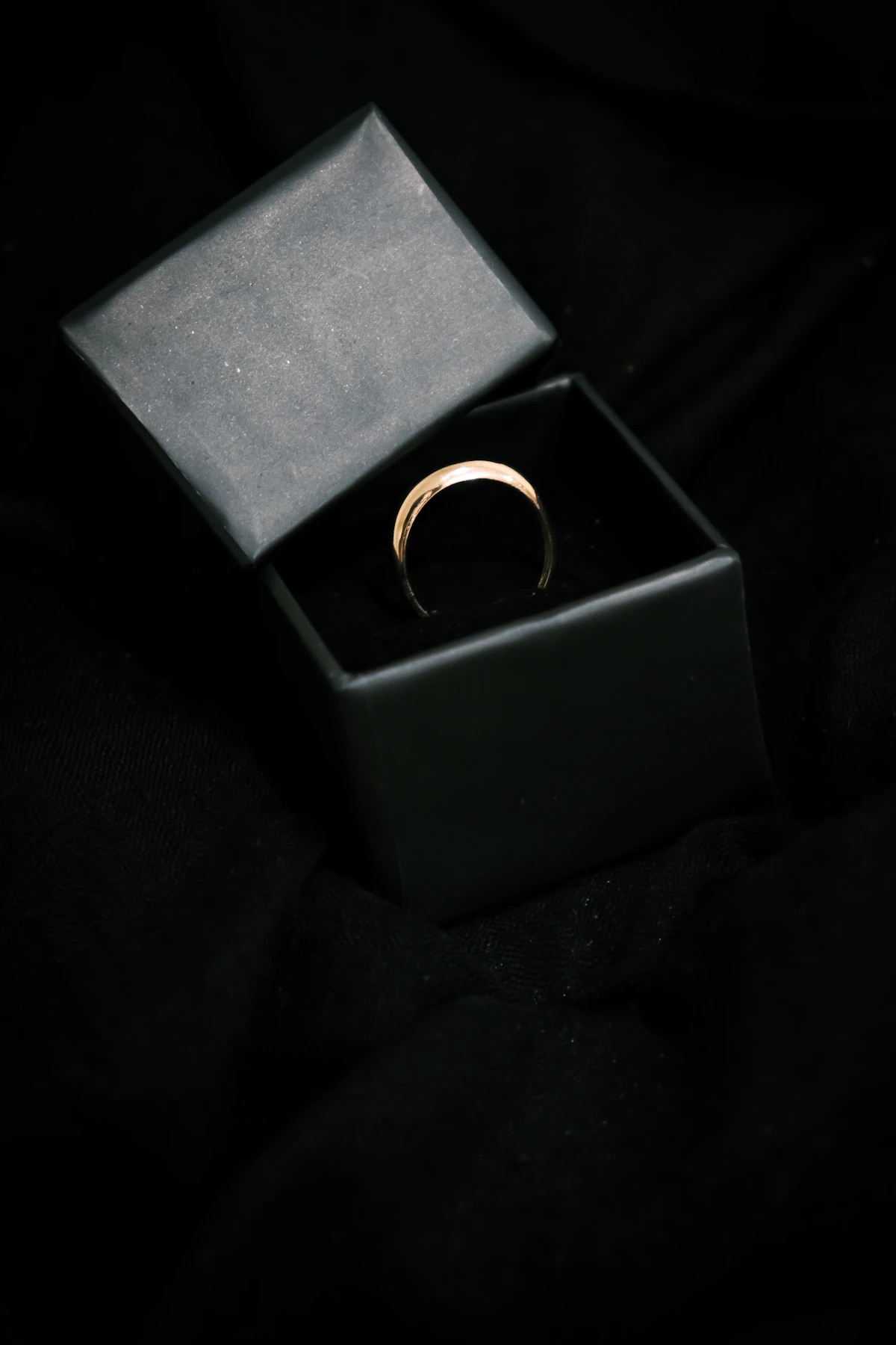 Premium gold ring displayed in a jewellery box