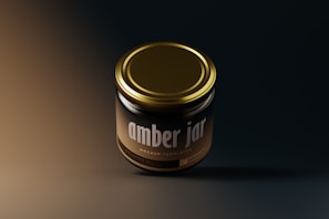 A radiant jar of golden ghee with glowing edges, floating against a dark mode backdrop with curvy borders.