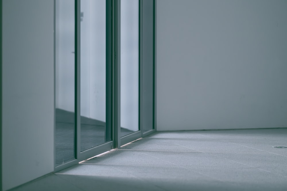 an empty room with a sliding glass door