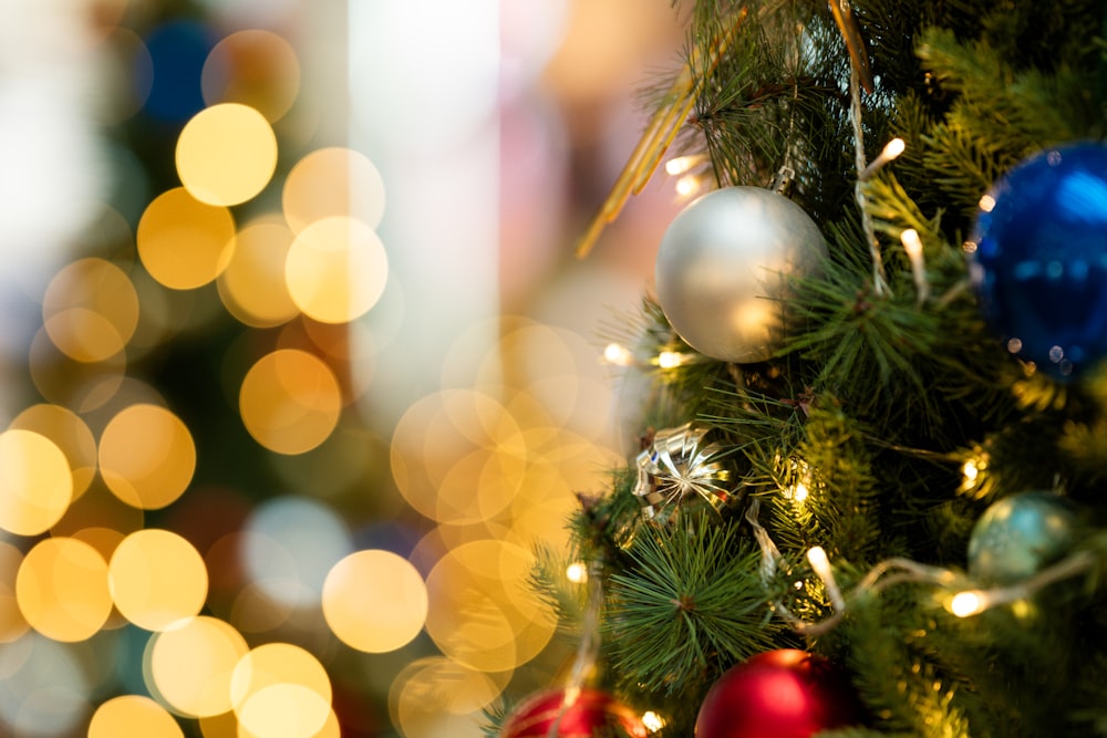 a close up of a christmas tree with ornaments