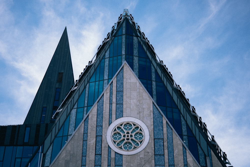 a church steeple with a stained glass window