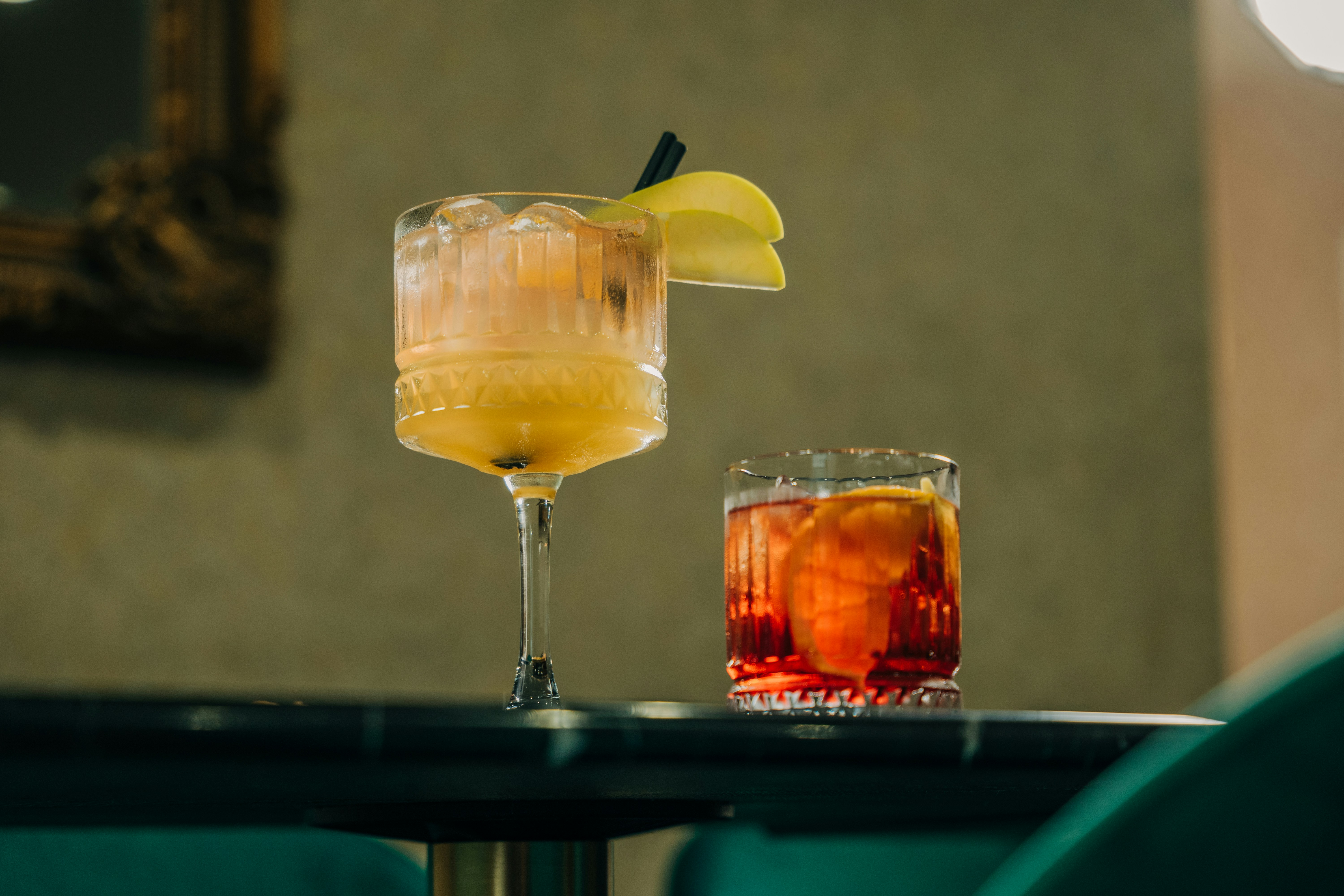 a couple of drinks sitting on top of a table