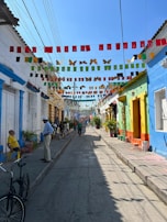 A colorful street scene featuring Chambeh's signature style.