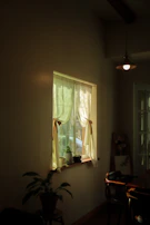 A peaceful patient room decorated in calming blues and greens with a touch of warm yellow light.