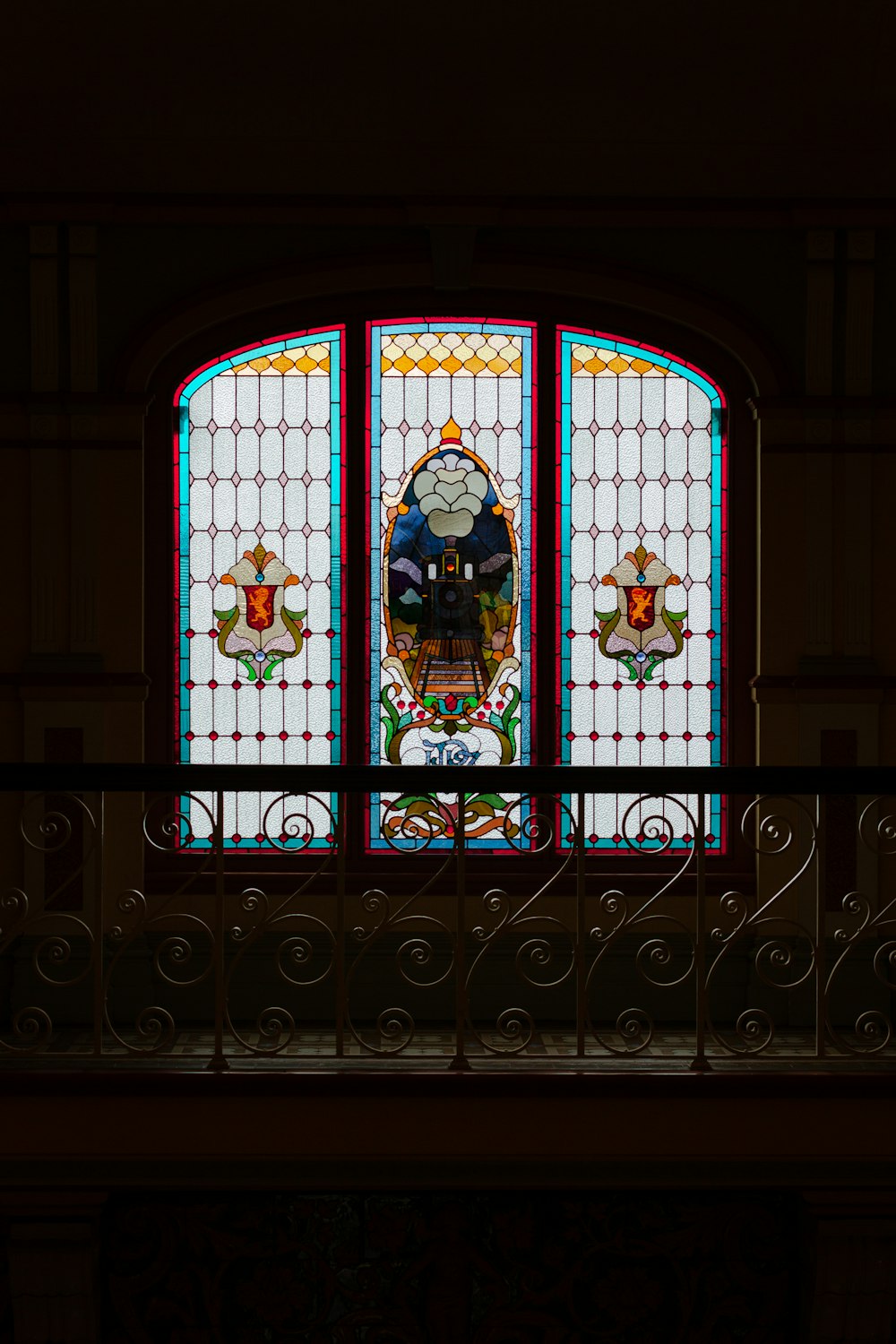 a large stained glass window in a building