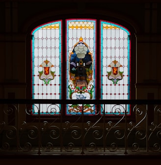 a large stained glass window in a building