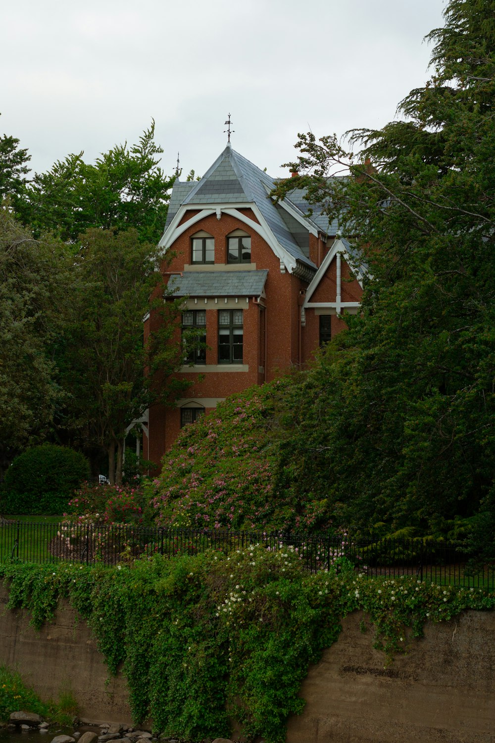 a large red brick building with a steeple on top of it