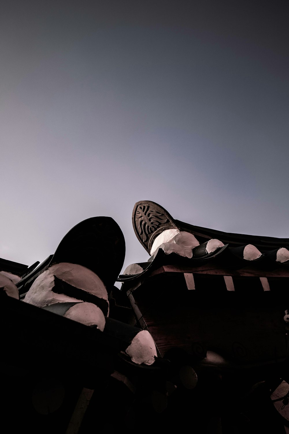 a person standing on top of a roof with their feet up