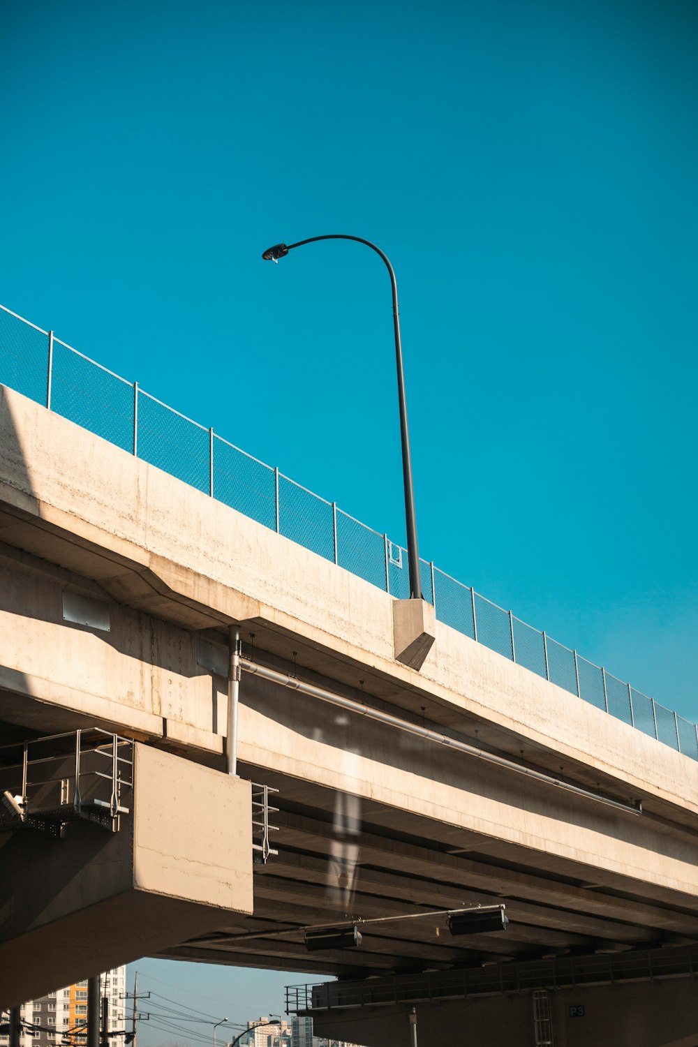 a street light on a pole above a bridge