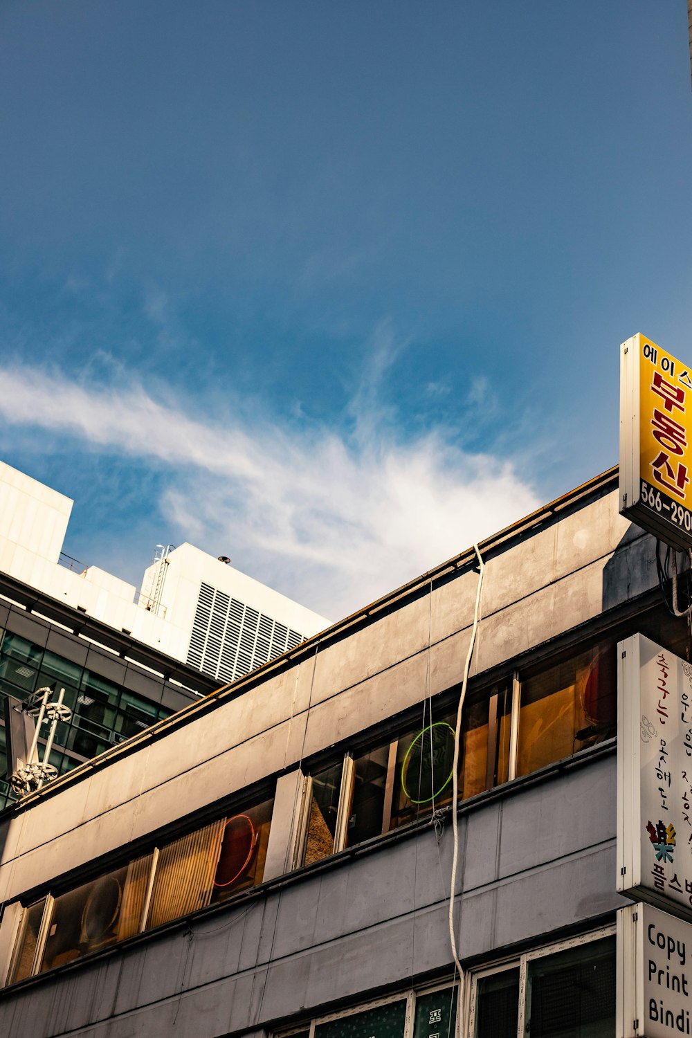 a tall building with a sign on the side of it