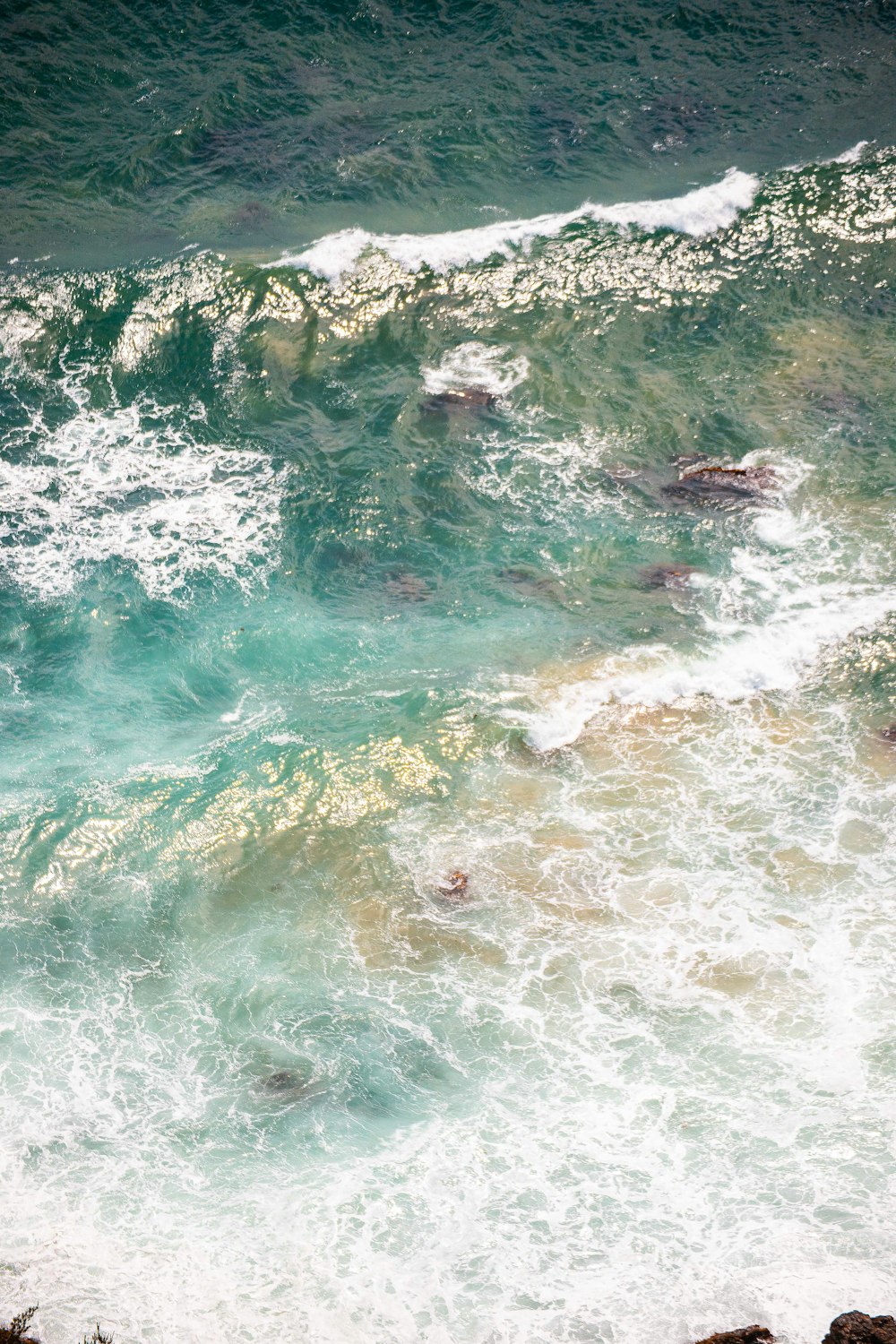 a man riding a surfboard on top of a wave in the ocean