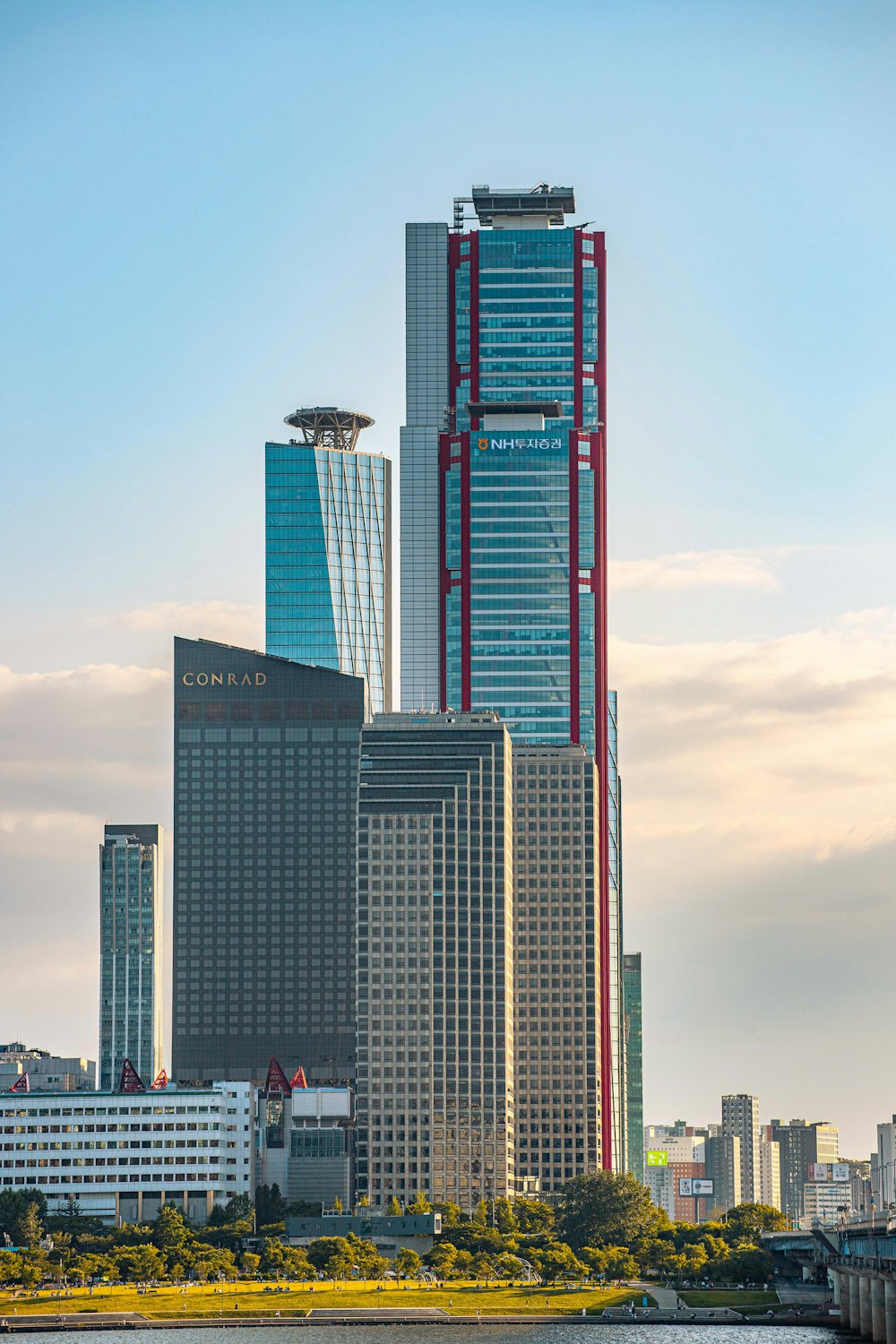 a large body of water in front of tall buildings