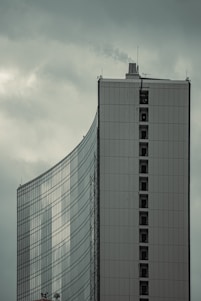 a very tall building with a clock on it's side