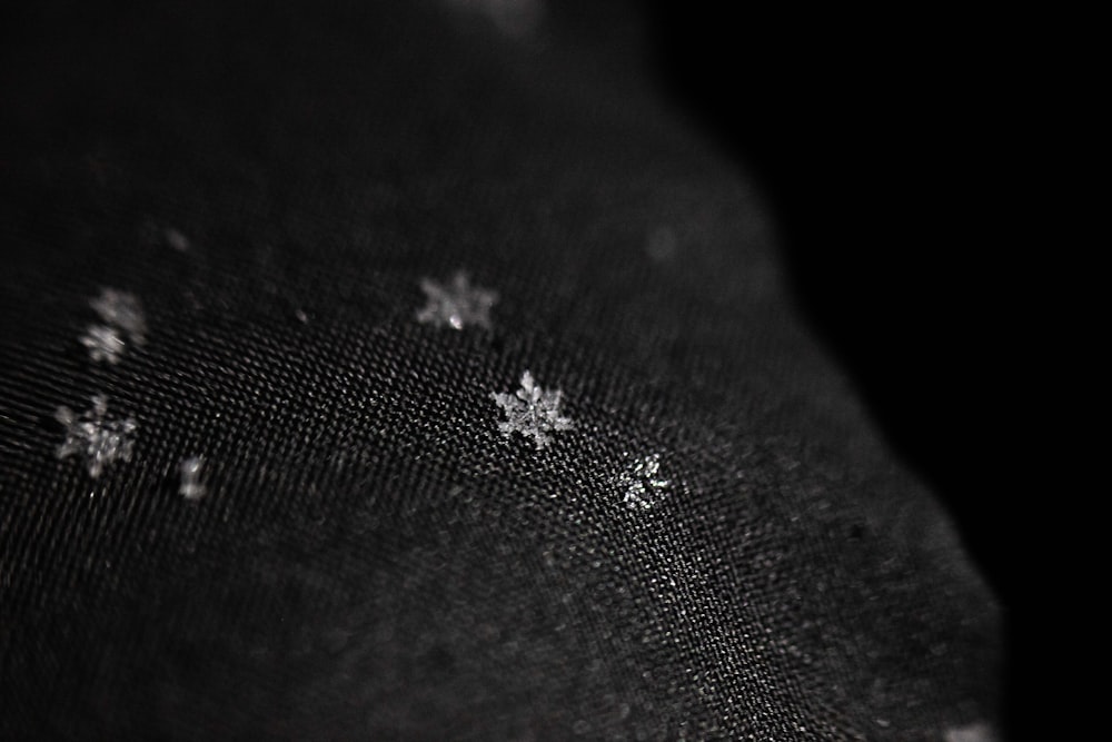 a black and white photo of snow flakes