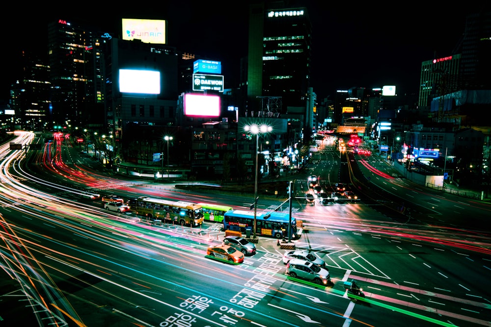 a city street filled with lots of traffic at night