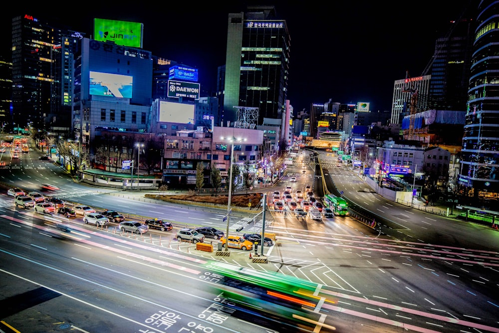 a city street filled with lots of traffic at night