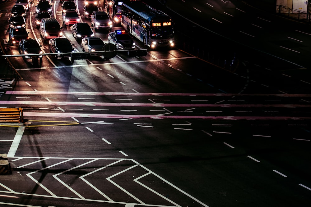 a city street filled with lots of traffic at night