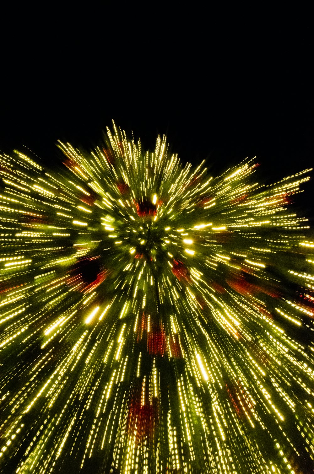 a large fireworks is lit up in the night sky