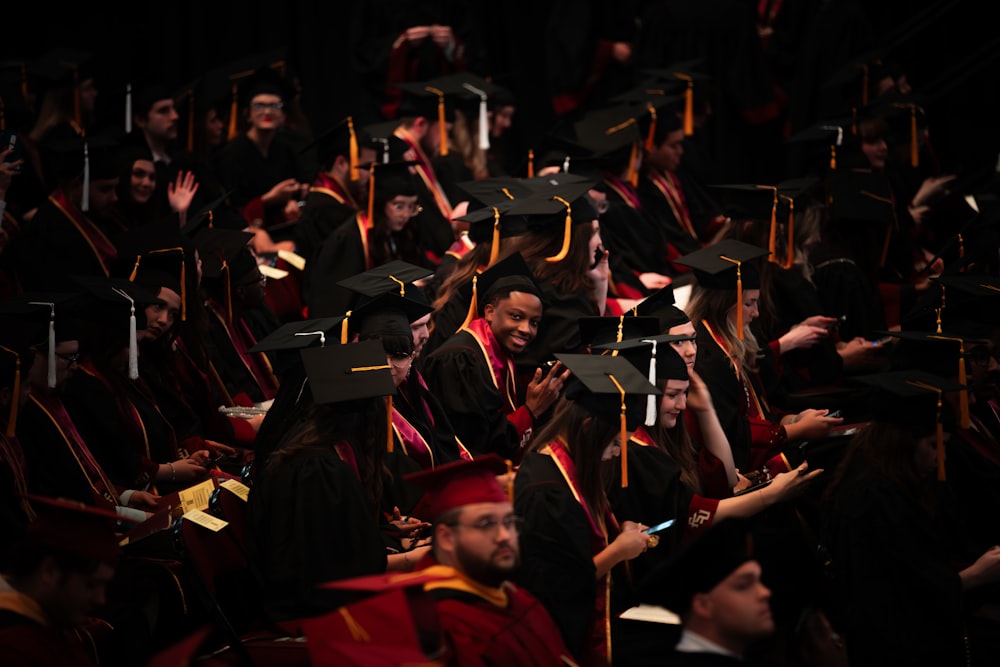 a large group of people in graduation caps and gowns