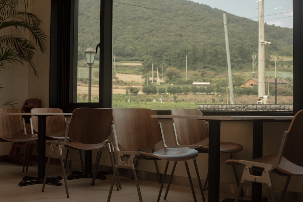 a row of chairs sitting in front of a window