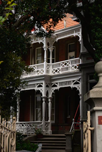 A vintage Victorian home in Newtown with workers carefully inspecting for asbestos.