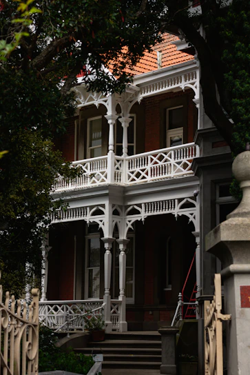 A vintage Victorian home in Newtown with workers carefully inspecting for asbestos.