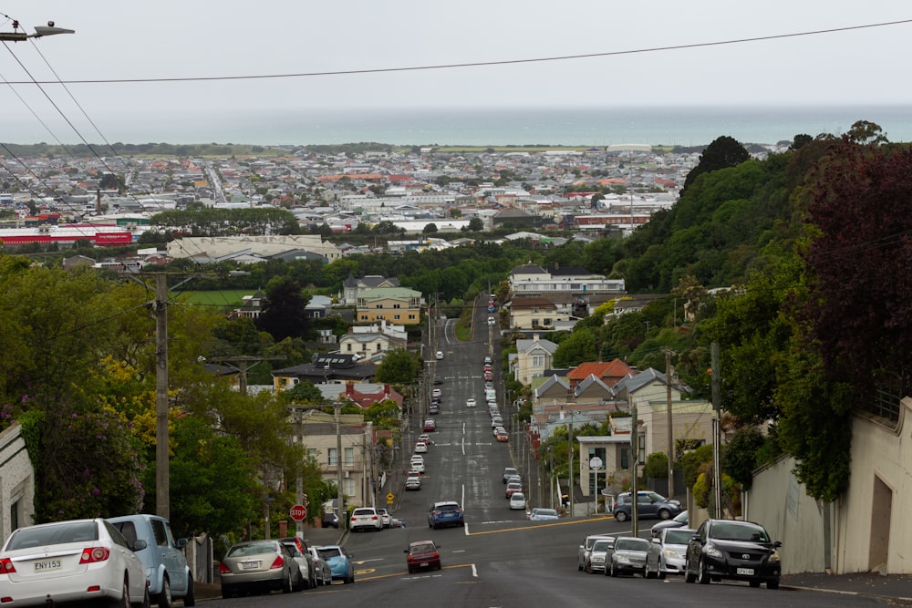 a city street with cars parked on both sides