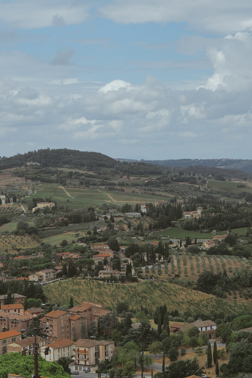 a view of a small town in the middle of a valley